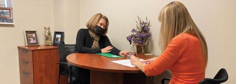 Mindy Rickard helps client with advance care plan